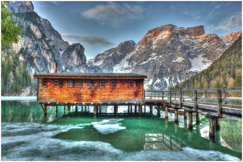 A captivating landscape of a rustic cabin perched