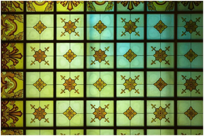 Detailed view of ornate stained glass with geometr