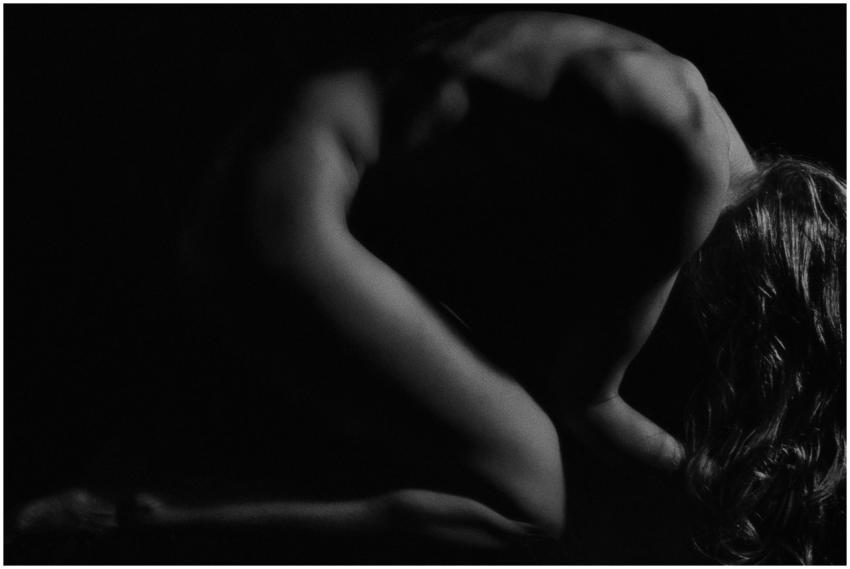 Tasteful black and white silhouette photo of a wom