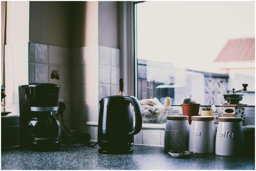 Cozy kitchen scene with coffee maker, kettle, and
