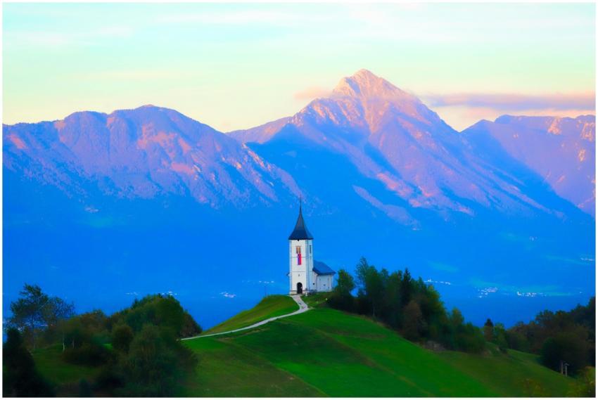 A charming church on a hilltop with majestic mount