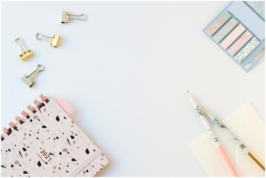 Flat lay of a stylish 2021 planner and stationery