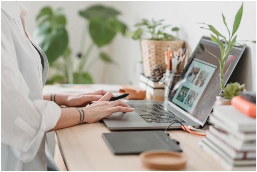 Freelance designer working from home using a lapto