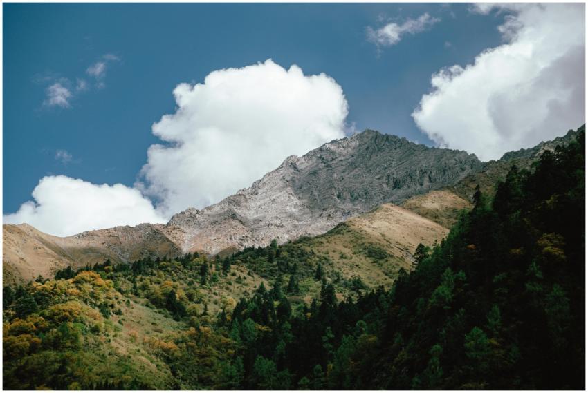 A breathtaking view of a mountain peak surrounded