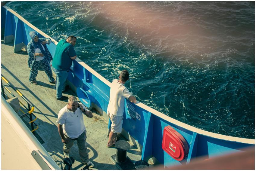 Adults enjoying a ferry ride in Çanakkale, Türkiye
