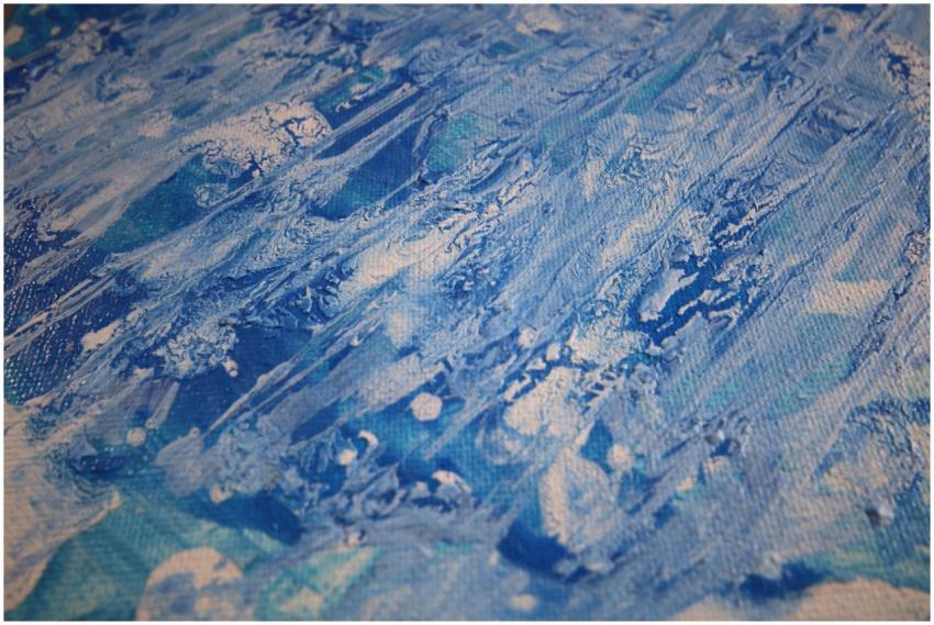 A stunning abstract painting with vibrant blue tex