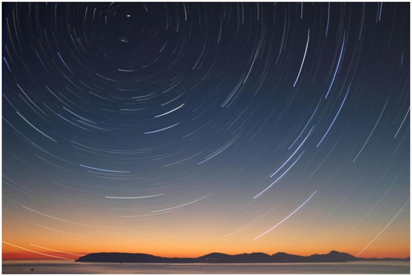 A stunning long exposure of star trails over the o
