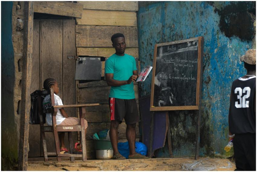 A teacher conducts an outdoor class for children i