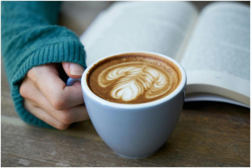 A warm cup of latte with beautiful latte art, next