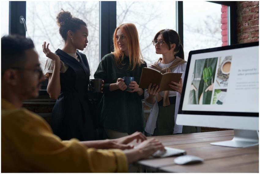Diverse team engaged in discussion and collaborati