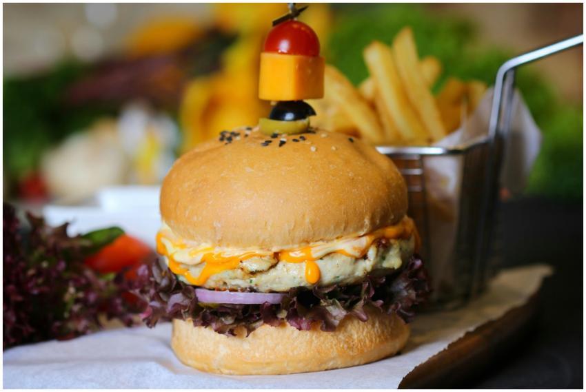 Tasty gourmet cheeseburger with a side of crispy f