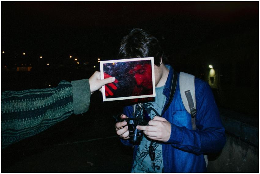 Unique night photography featuring a person holdin