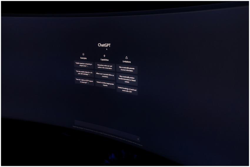 A dark, minimalist photo of a computer monitor dis