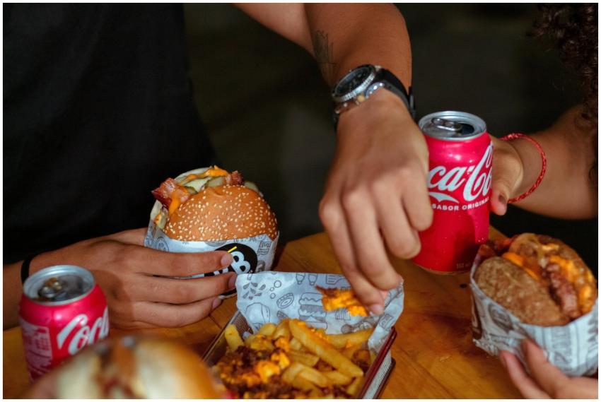 Enjoying delicious burgers and fries with friends