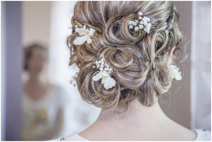 Close-up of an elegant bridal hairstyle featuring