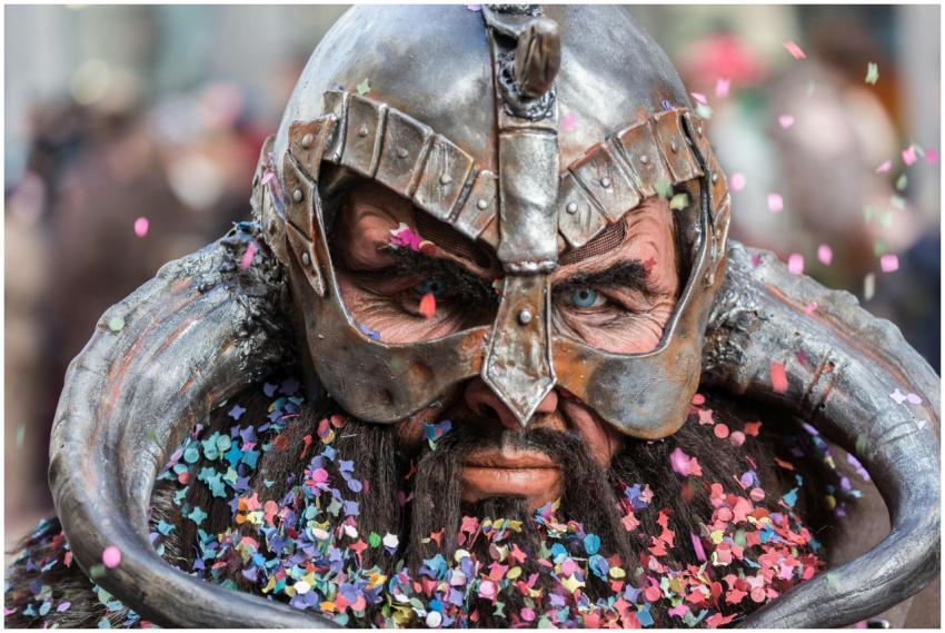 Close-up of a man in Viking cosplay with confetti