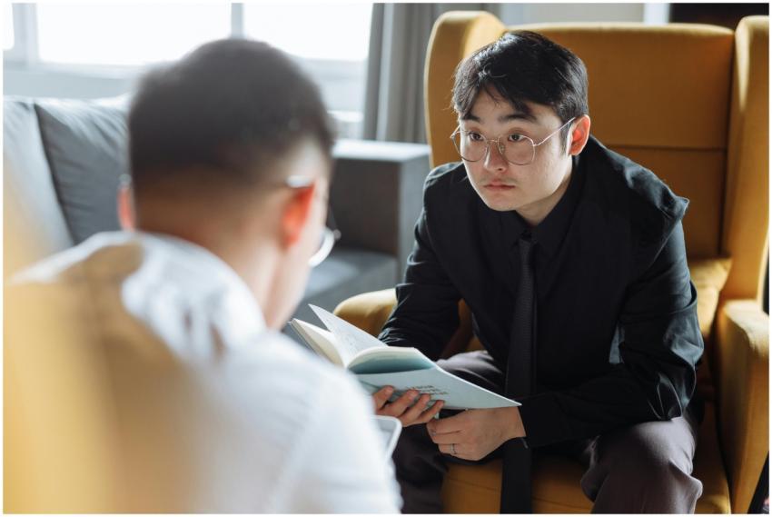 Two men in corporate attire having a serious discu