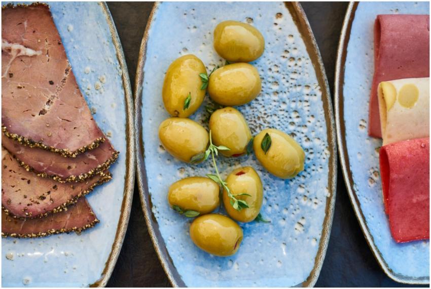 Top view of rustic charcuterie plates featuring ol