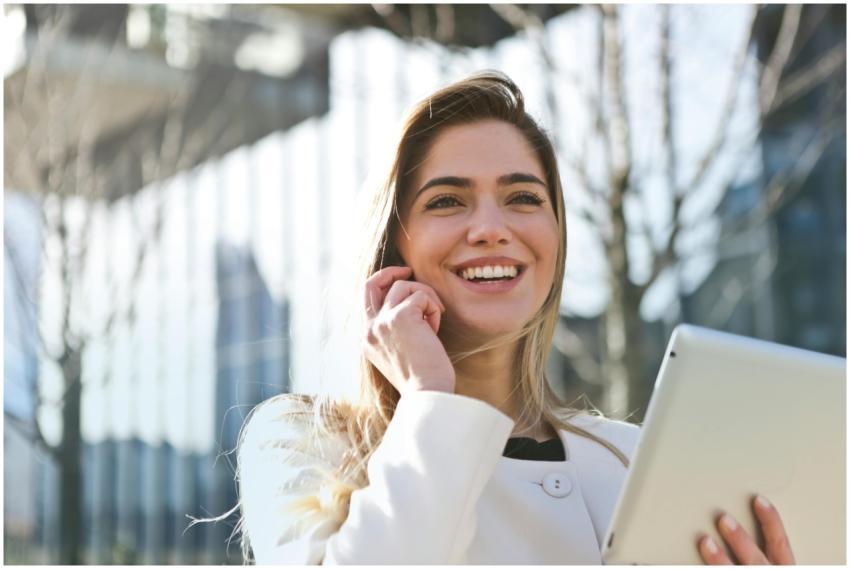 Confident businesswoman using her tablet and phone