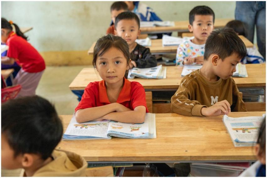Children attentively studying in a classroom setti