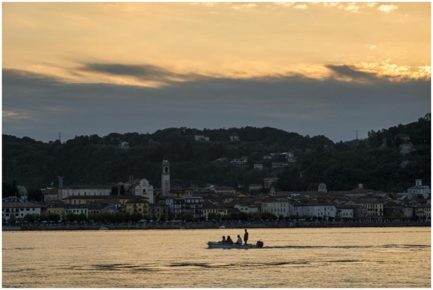 A picturesque boat ride during sunset with a backd