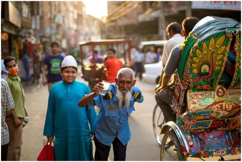 A lively street in Bangladesh with people, colorfu