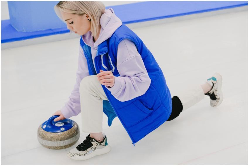 Full body of concentrated young female player wear