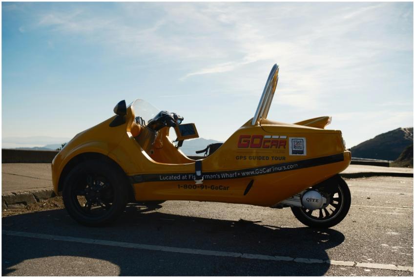 Yellow GoCar parked on a Los Angeles road with sce