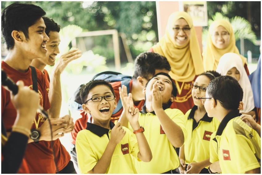 A group of school children enjoying a celebratory