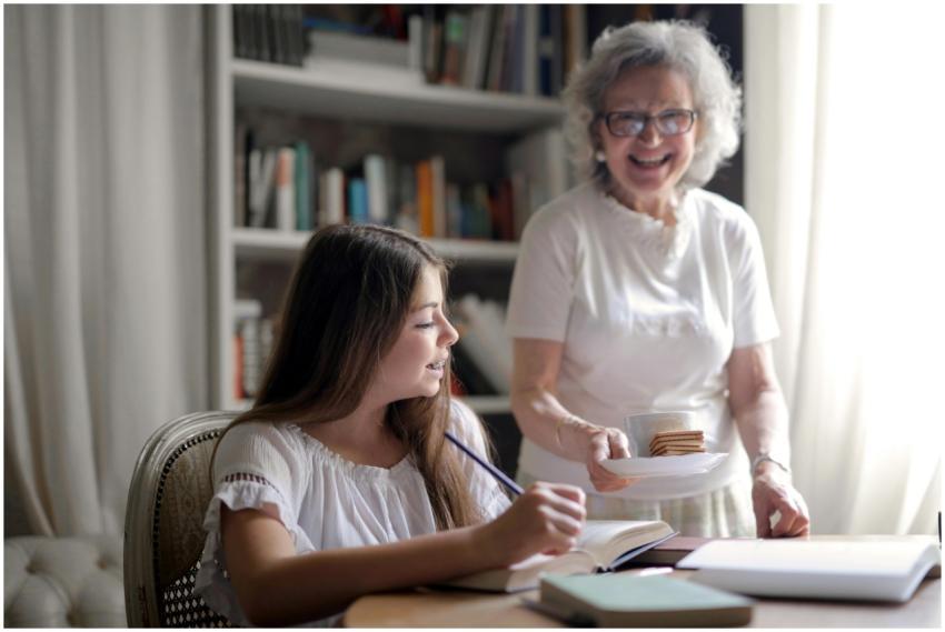 Cheerful grandmother in glasses and casual clothes