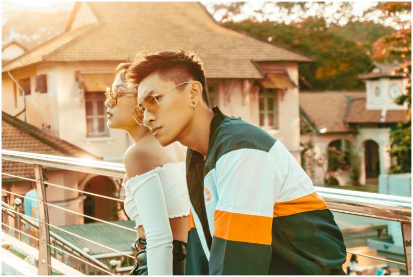 Stylish young couple with sunglasses posing outdoo