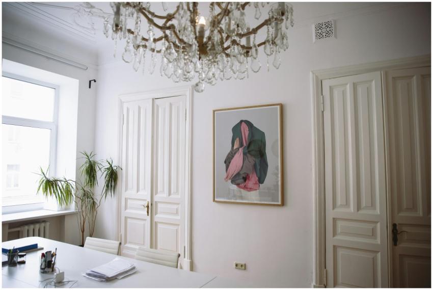 Bright office space featuring classic decor, a cha