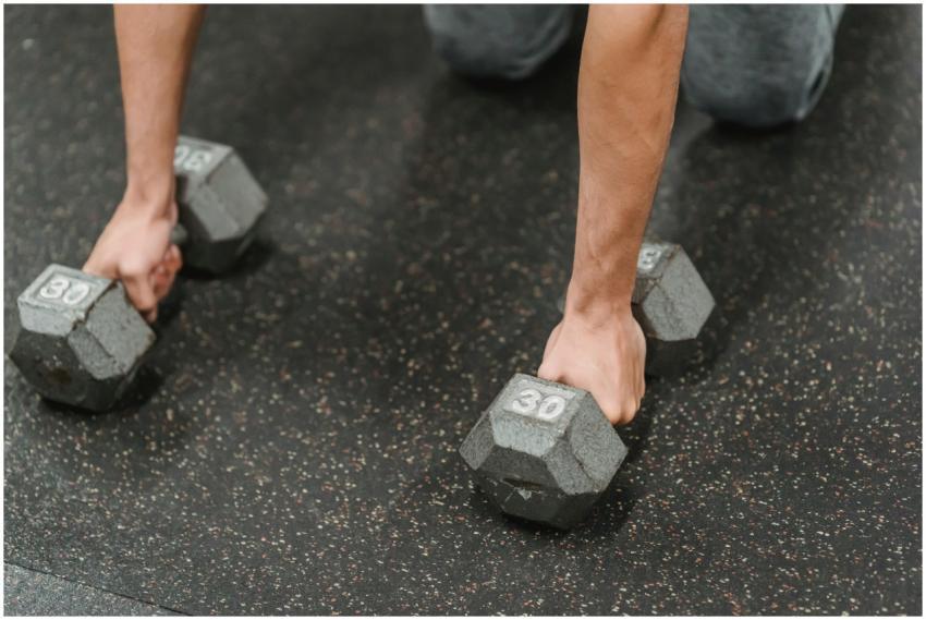 High angle of crop anonymous male athlete standing