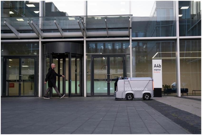 A modern office setting featuring a man and an aut