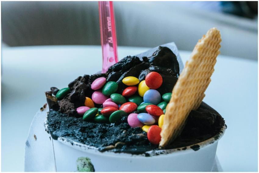 A delicious ice cream cup adorned with colorful to