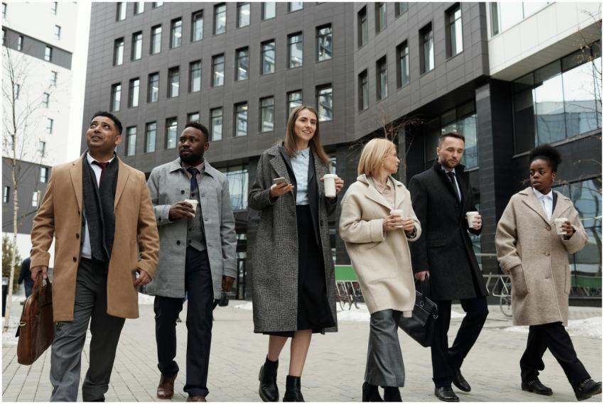 A diverse group of business professionals walking
