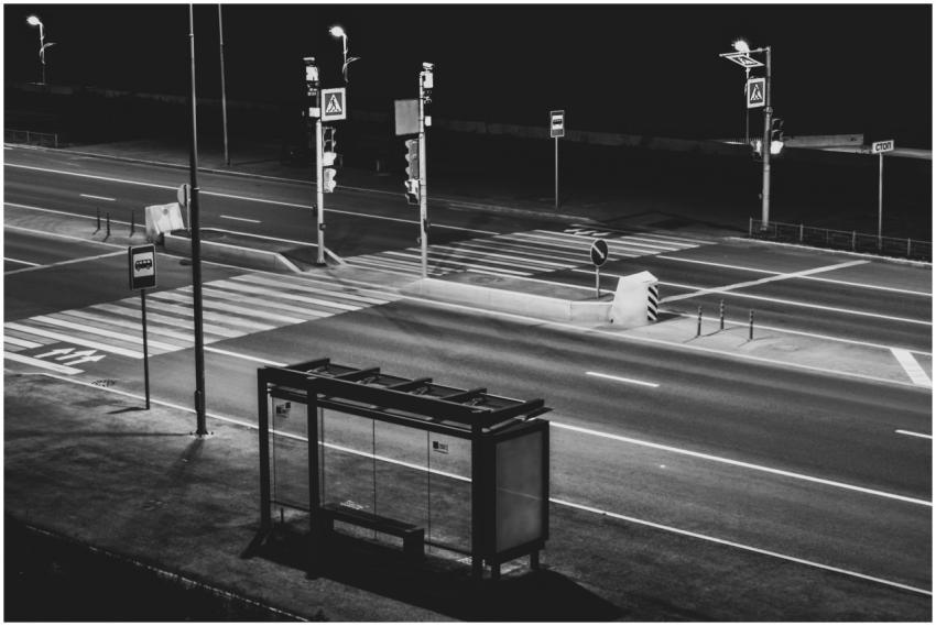 Black and white image of an empty city crosswalk a