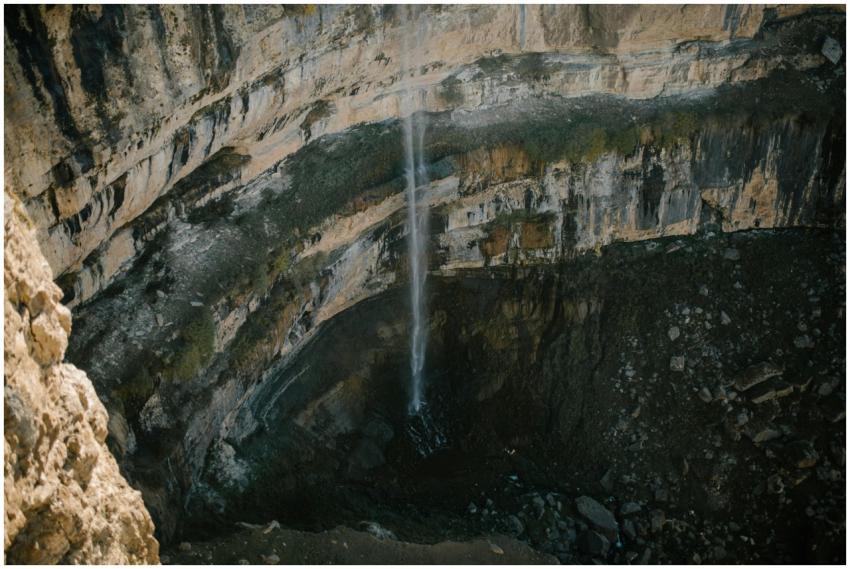 A breathtaking aerial view of a waterfall cascadin