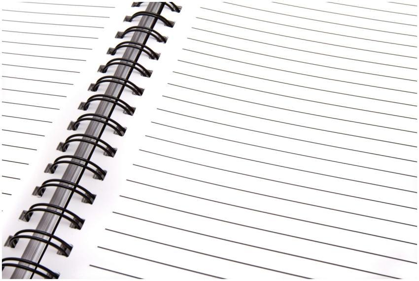 Open spiral notebook with lined pages, perfect for