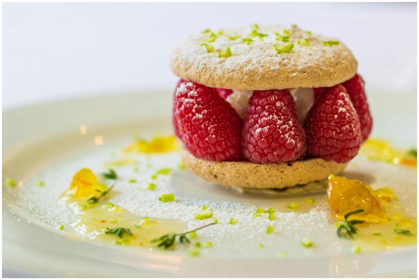 Scrumptious raspberry-filled cookie topped with ic