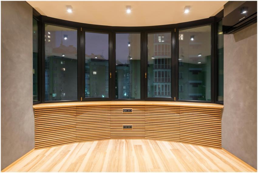 Stylish modern apartment space featuring large win