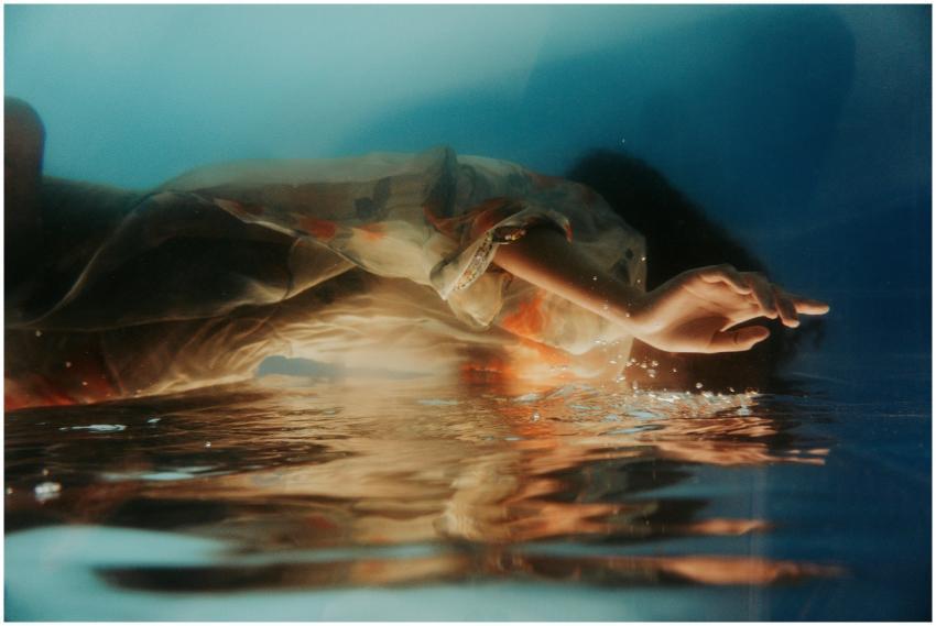 Artistic underwater capture of a woman submerged,