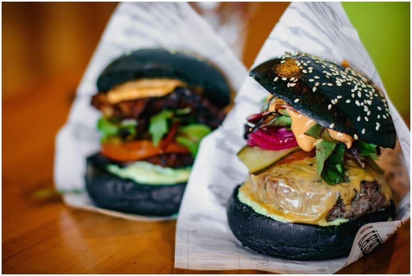 A visually appealing gourmet cheeseburger with a b