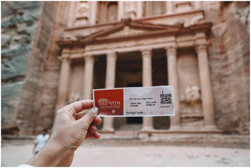 Tourist holding a ticket in front of Al Khazneh te