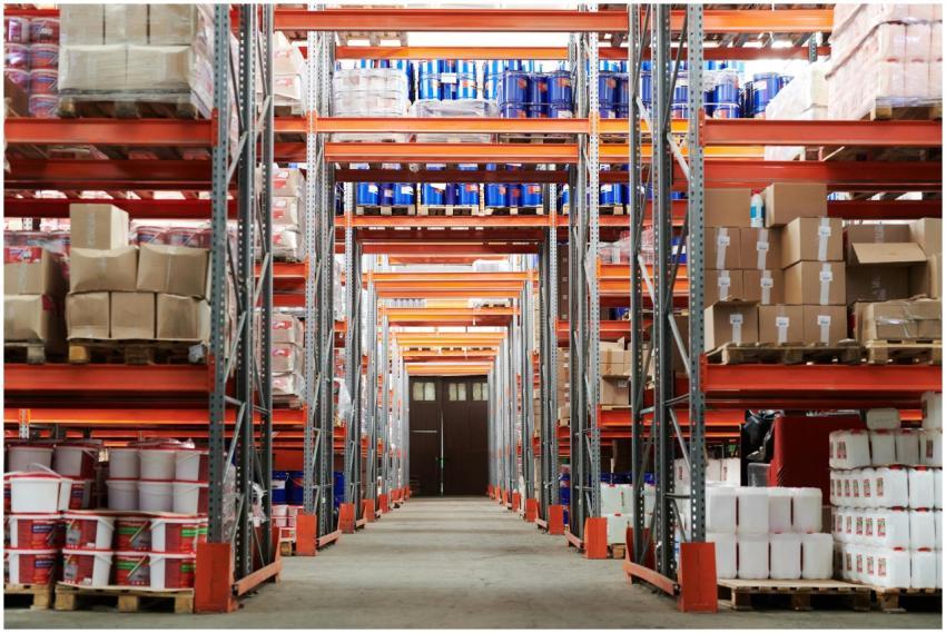 Wide angle view of a warehouse with stocked shelve