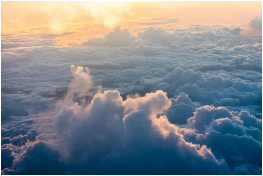 Stunning aerial view of sunlit clouds during sunri