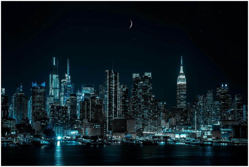 A breathtaking view of a city skyline at night und