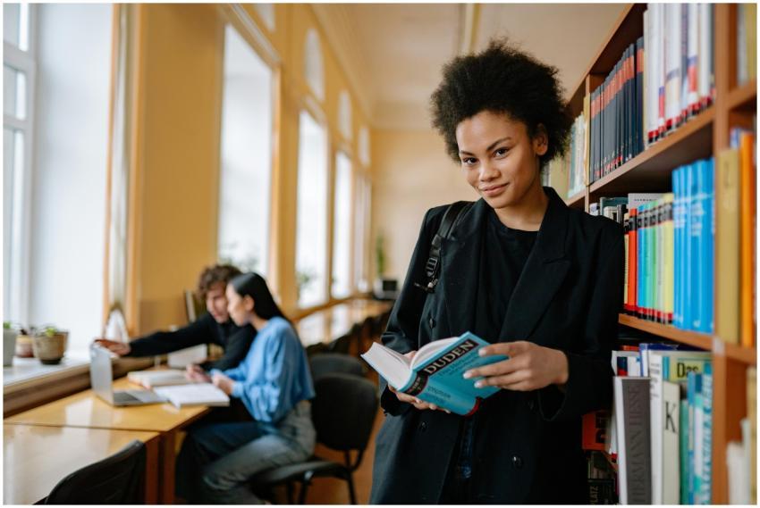 African American woman reading a book in a bright