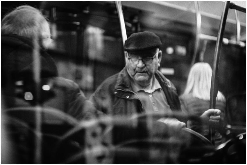 Black and white photo capturing an older man on a