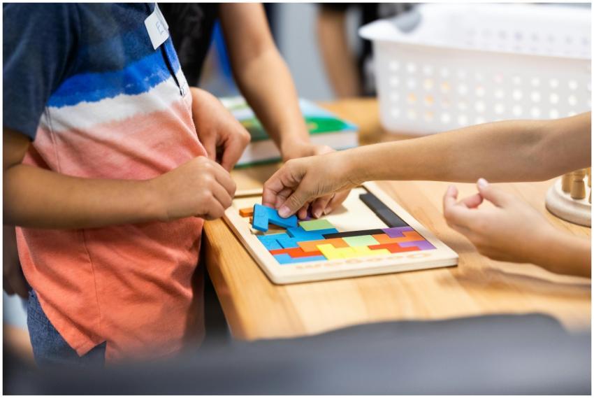 Young children learning with colorful puzzle piece
